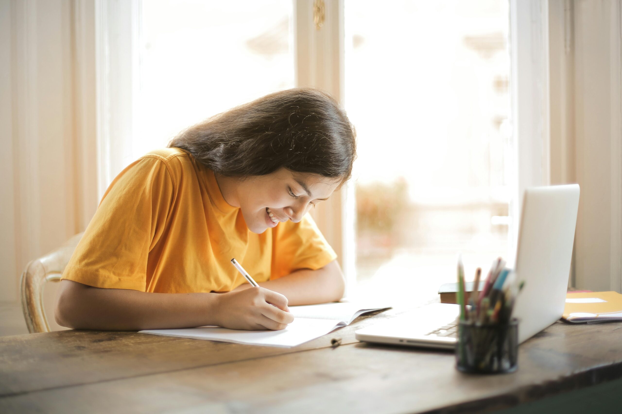 Girl writing an essay.